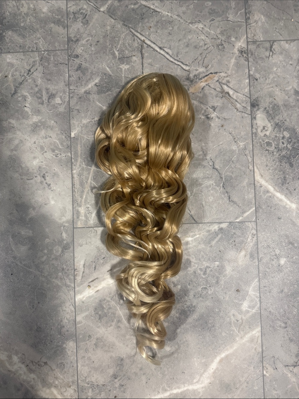 2/$45. 22” Synthetic Blonde Curly Clip-In Pinytail Extension - Golden Blonde